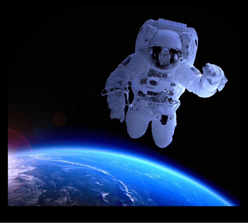 Stunning view of an astronaut in outer space gazing at the camera, with the blue Earth visible against the dark background. The scene conveys a sense of high-tech achievement, scientific excellence, and the spirit of discovery and innovation.